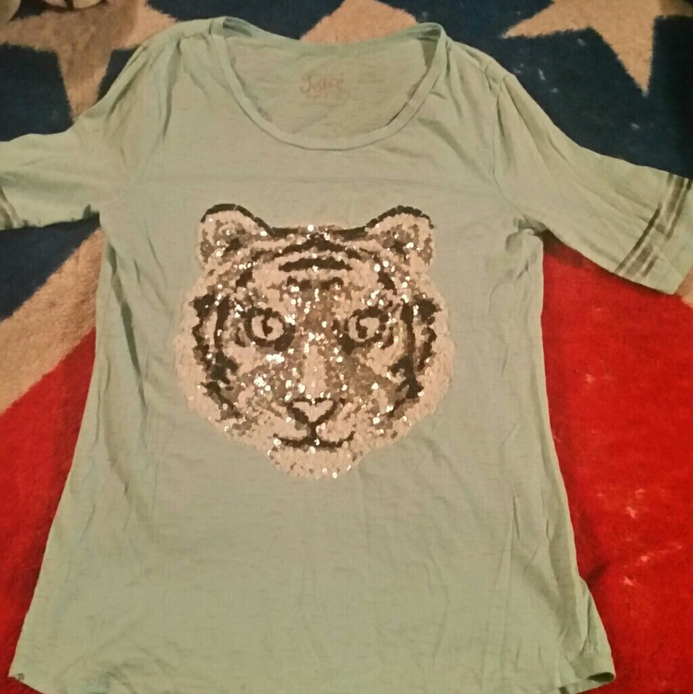 A light blue short sleeve Justice shirt